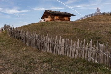 Fototapeta na wymiar Wooden Cottages in the Dolomites