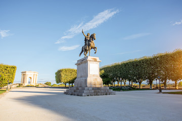 View on the beautiful Peyrou promenade with Louis statue in Montpellier city during the morning light in southern France © rh2010