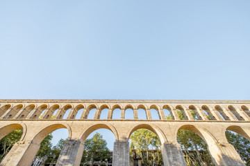Fototapeta premium View on the saint Clement aqueduct in Peyrou garden during the morning light in Montpellier city in southern France