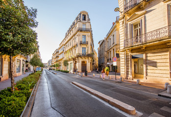 Street view with beautiful old luxurois buildings on the Foch boulevard during the morning light in Montpellier city in Occitanie region of France