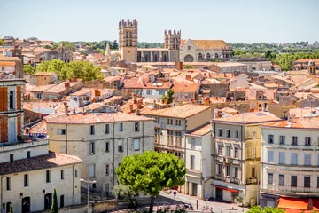 Papier Peint photo Monument historique Aerial cityscape view on the old town with cathedral in Montpellier city during the sunny weather in Occitanie region of France