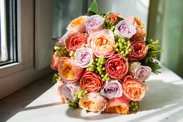 Beautiful bridal bouquet on the window sill