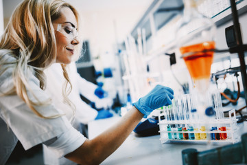 Female student of chemistry working in laboratory