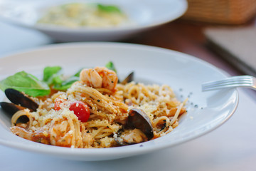 Italian food - spaghetti pasta with seafood - mussels and shrimps.