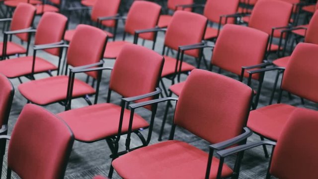 conference hall studio cinema theater empty red diagonal view seats line chairs stools seating place audience nobody public place seminar lecture university seating sitting space modern auditorium