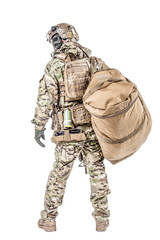 Soldier standing with duffel bag studio shot