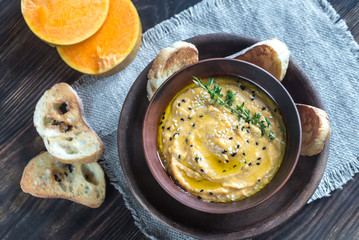 Bowl of pumpkin hummus