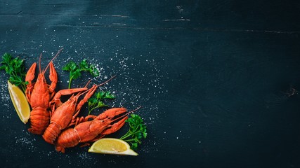 Lobster. Seafood. On a wooden background. Top view. Free space for your text.