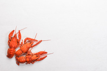 Lobster. Seafood. On a wooden background. Top view. Free space for your text.