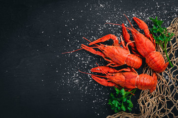 Lobster. Seafood. On a wooden background. Top view. Free space for your text.