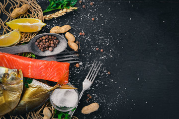 Seafood. Fish Vomer, lobster, salmon. On a wooden background. Top view. Free space for text.