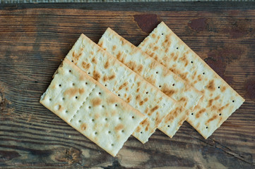 several cookies cracker on a simple wooden background