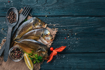 Seafood. Fish Vomer, lobster, salmon. On a wooden background. Top view. Free space for text.