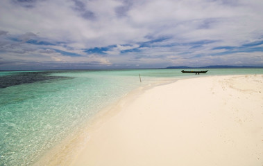 wild beach on an atoll in raja ampat archipelago
