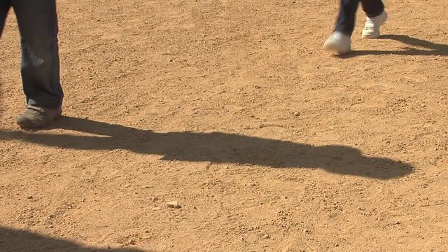 People walking in dirt