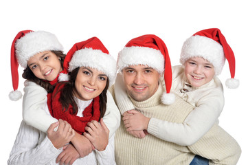 family with kids   in santa hats