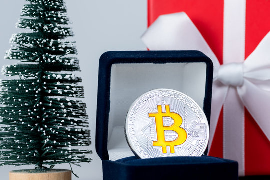 Coin Bitcoin in a gift box for jewelry, ring. Crypto-currency 2018 trend. The best gift for the Christmas and new year holiday