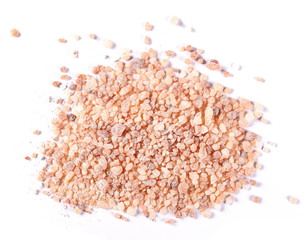 Himalayan salt grains isolated on white background, top view