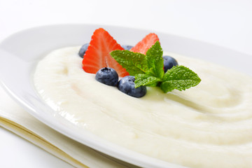 plate of semolina pudding with fruit