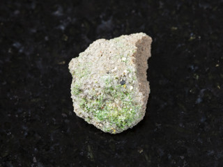 green Pintadoite crystals in raw stone on dark