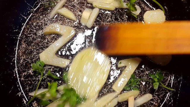 fry potatoes in a frying pan in the form of number 2018