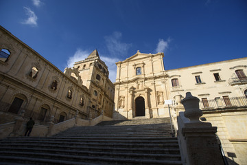 Fototapeta na wymiar Facade and stairs of the Church of Saint Francis Immaculate in the Noto, Sicily, Italy
