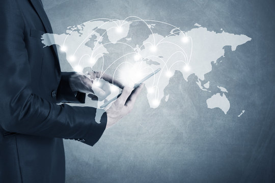 business man with global connections device and map