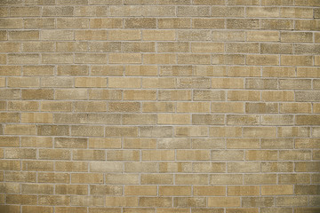Old beige brick wall background texture