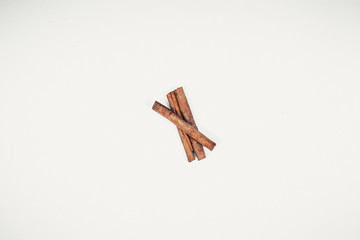 Cinnamon sticks on white background. Top view.