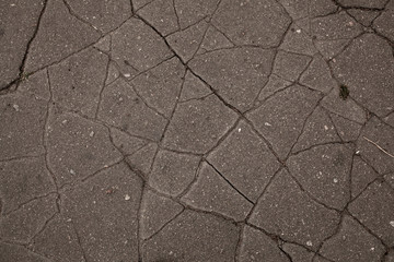 Obraz premium Old road background - surface of grey cracked asphalt texture