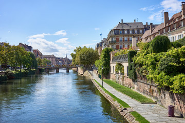 River of Strasbourg in Alsace, France / Traditional colorful houses at river in La Petite France 