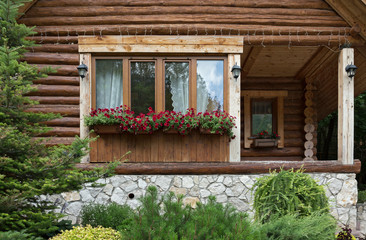 Window with flowers in chalet