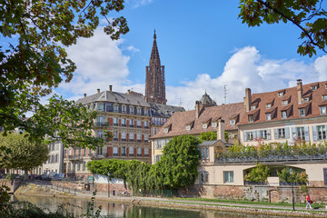 Fototapeta premium River of Strasbourg in Alsace, France / Traditional colorful houses at river in La Petite France 