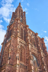 Fototapeta premium Great Cathedral Notre Dame de Strasbourg before blue Sky in Alsace, France