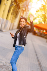 A happy young woman enjoying the autumn in a Central European ci