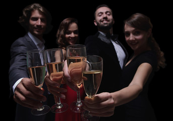 Cheerful people celebrating a sucess with Champagne