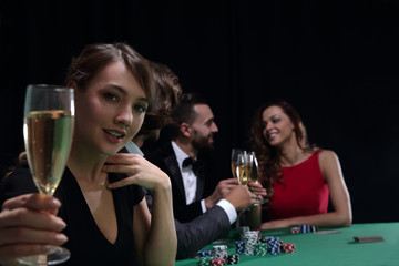 young beautiful woman playing in casino