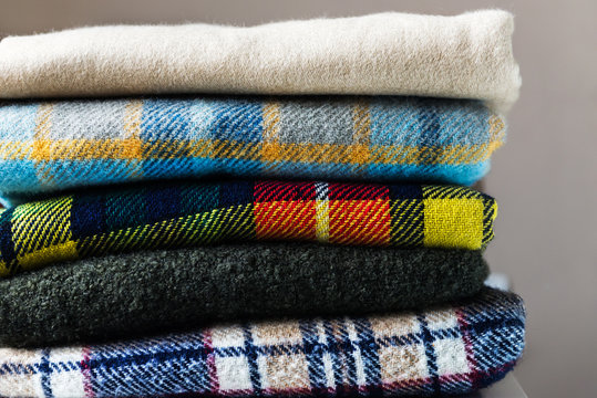Stack Of Woolen Checked Blankets