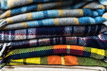 Stack of woolen checked blankets