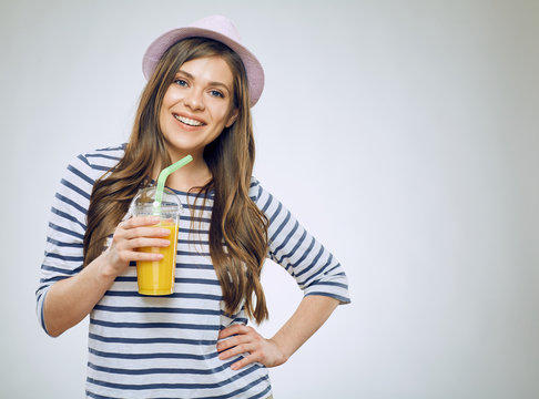 Modern girl drinking orange juice.
