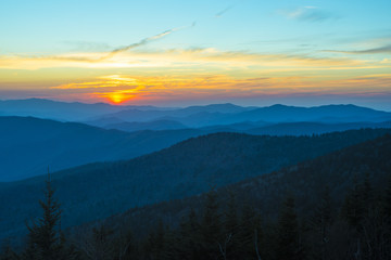 Spectacular Sunset in Smoky Mountains with Blue Ridge hills layered to the horizon with orange red sky