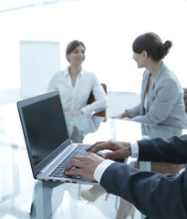 closeup of businessman typing on laptop.