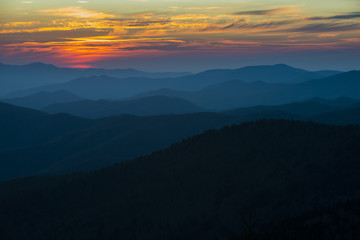 Spectacular Sunset in Smoky Mountains with Blue Ridge hills layered to the horizon with orange red sky - Powered by Adobe