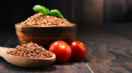 Bowl of buckwheat kasha on wooden table