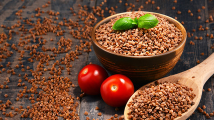 Bowl of buckwheat kasha on wooden table