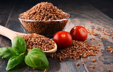 Bowl of buckwheat kasha on wooden table