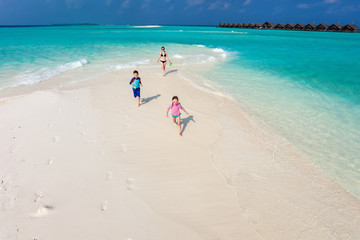 Kids running at beach