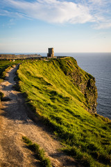 cliffs of moher in the evening with O&rsquo;Brien&rsquo;s Tower