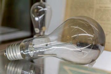 lightbulb on glass shelf