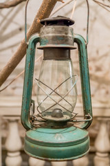 vintage hand lamp hanging on tree